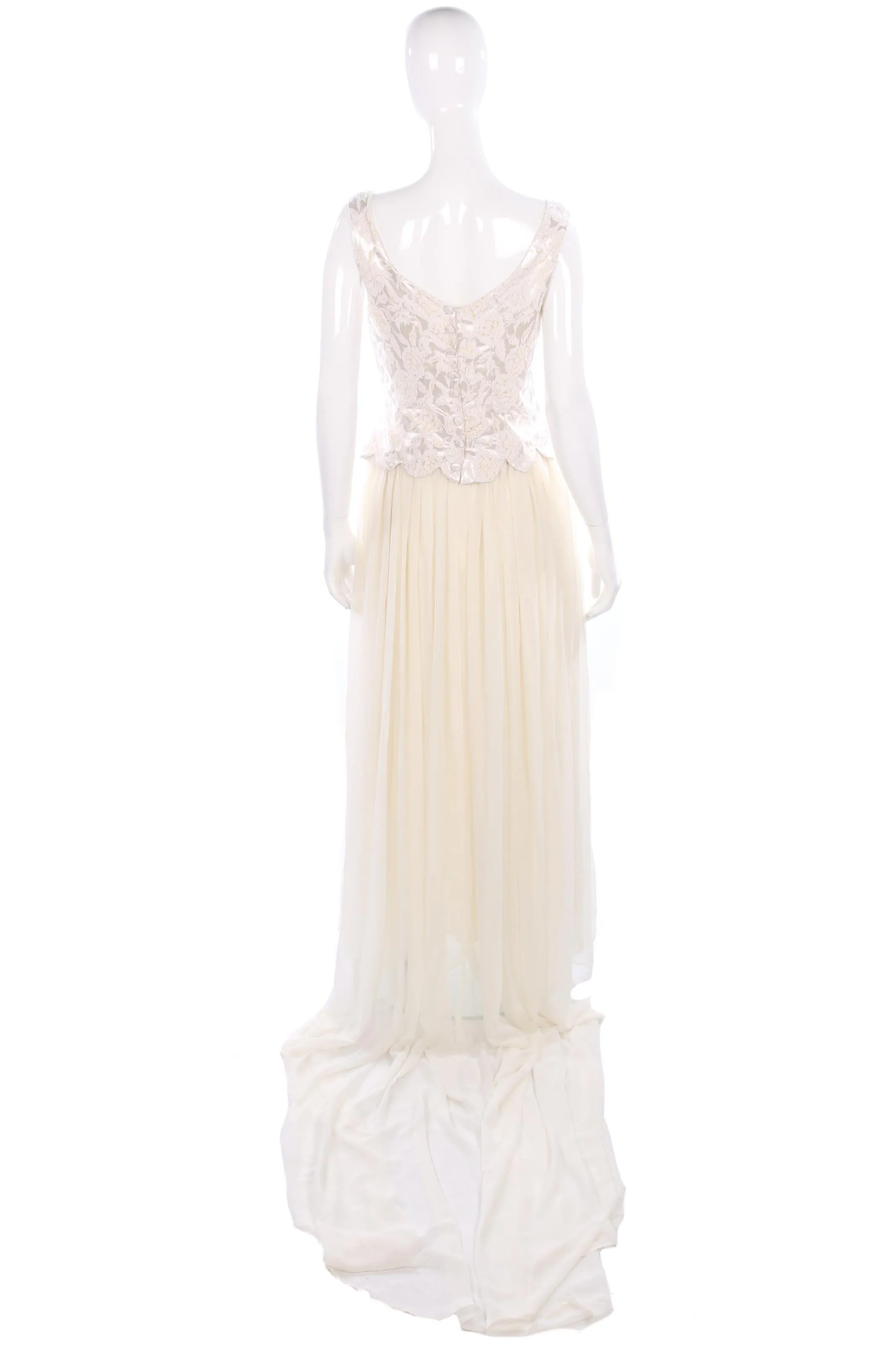 Vintage wedding dress with metallic scalloped top detail and long train